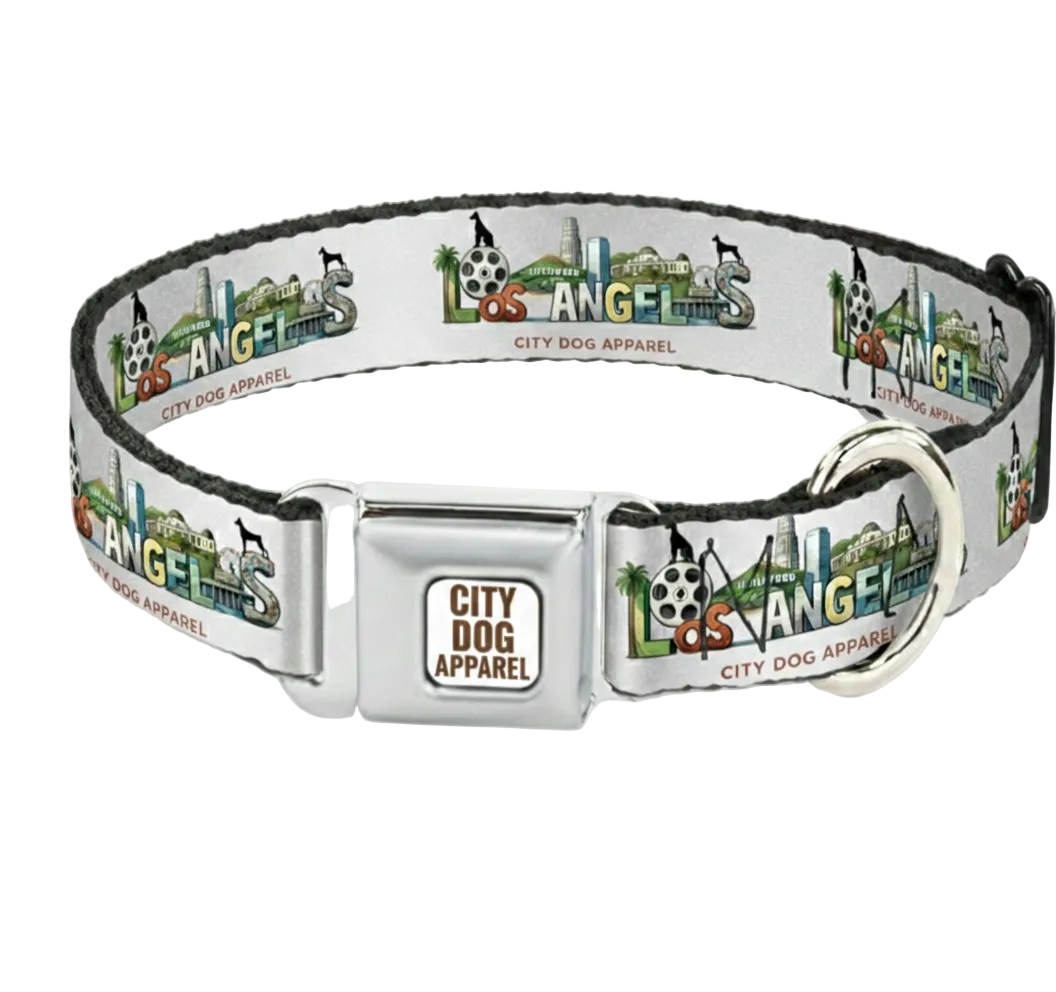 A silver metal dog collar with a white printed strap featuring the Los Angeles skyline and 'City Dog Apparel' branding, shown on a light gray background.