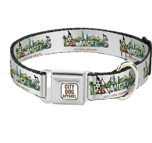 A silver metal dog collar with a white printed strap featuring the Los Angeles skyline and 'City Dog Apparel' branding, shown on a light gray background.